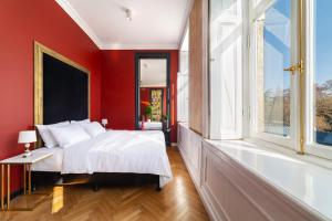 a bedroom with a large bed and a bath tub at Unfound Door - Design Hotel in Tbilisi City