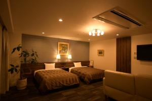 Uma cama ou camas num quarto em Sakura Shimanami Hotel