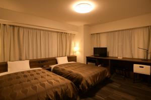 Uma cama ou camas num quarto em Sakura Shimanami Hotel