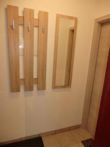a bathroom with three mirrors on a wall at Apartment in Abstatt mit 5min zur A81 in Abstatt