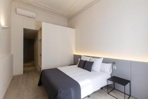 Postel nebo postele na pokoji v ubytování Izaila Plaza Catalunya