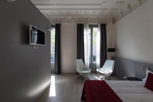 TV a/nebo společenská místnost v ubytování Izaila Plaza Catalunya