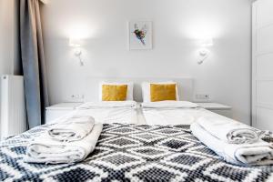 Posteľ alebo postele v izbe v ubytovaní Bella Casa Premium Apartment - 30 Pszczelna