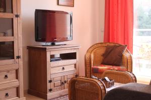 a living room with a tv on a dresser at APARTMENT LA ROTA - Benidormland in Cala de Finestrat