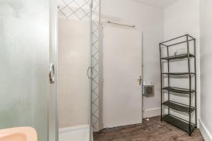 a bathroom with a shower with a glass door at Maison conviviale à Bourbon-Lancy avec équipements modernes in Bourbon-Lancy +15 photos