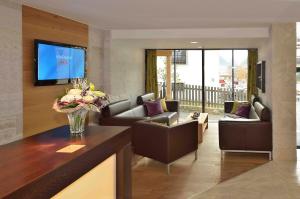 TV a/nebo společenská místnost v ubytování Hotel Garni Fimba