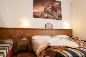 Postel nebo postele na pokoji v ubytování Hotel Residence Chateau