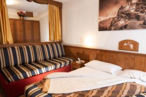 Postel nebo postele na pokoji v ubytování Hotel Residence Chateau