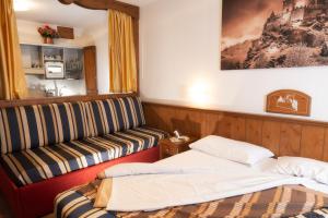 Säng eller sängar i ett rum på Hotel Residence Chateau