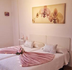 A bed or beds in a room at El Dorado Sun Las Américas by Vapagó Tenerife