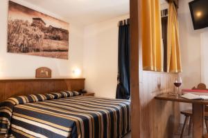 Postel nebo postele na pokoji v ubytování Hotel Residence Chateau