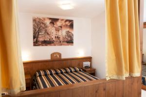 Postel nebo postele na pokoji v ubytování Hotel Residence Chateau