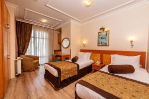 Postel nebo postele na pokoji v ubytování Santa Ottoman Hotel