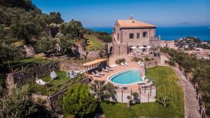 an aerial view of a house with a swimming pool at Agriresort Villa Edera in Massa Lubrense
