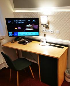 TV a/nebo společenská místnost v ubytování Hotel Grille