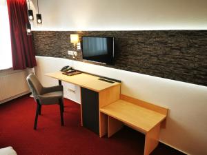 TV a/nebo společenská místnost v ubytování Hotel Grille