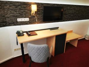 TV a/nebo společenská místnost v ubytování Hotel Grille