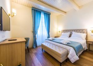Postel nebo postele na pokoji v ubytování Relais Paradiso Resort & Spa
