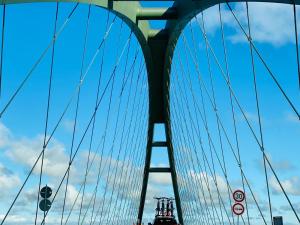 a bridge with a blue sky in the background at Kajüthus Apartment 6 in Fehmarn +1 photo