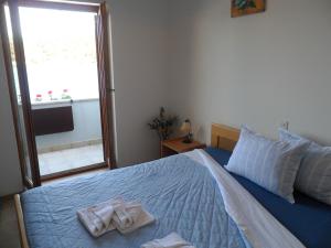 Postel nebo postele na pokoji v ubytování Sobe MaMaLu