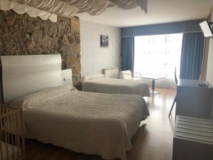Кровать или кровати в номере EL CAPRICHO DE CLEMENTE