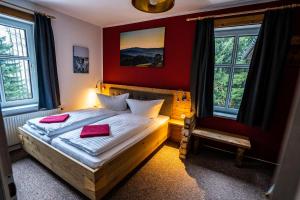 Postel nebo postele na pokoji v ubytování Berghotel Bärenstein