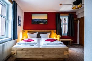 Postel nebo postele na pokoji v ubytování Berghotel Bärenstein