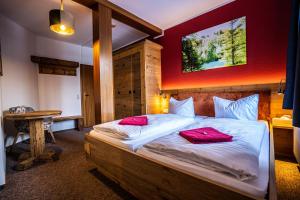 Postel nebo postele na pokoji v ubytování Berghotel Bärenstein