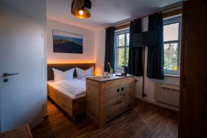 Postel nebo postele na pokoji v ubytování Berghotel Bärenstein