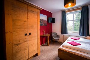 Postel nebo postele na pokoji v ubytování Berghotel Bärenstein
