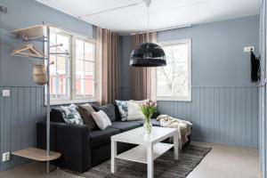 a living room with a couch and a table at Stockeboda Gård in Gärsnäs