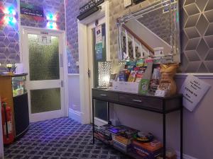 a room with a table with food on it at A&P at The Sheron House in Blackpool