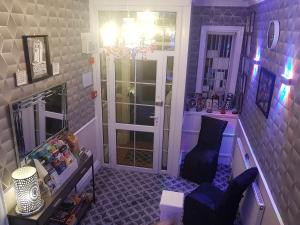 a purple room with a chair and a door at A&P at The Sheron House in Blackpool
