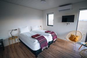 Voodi või voodid majutusasutuse Brú Guesthouse toas