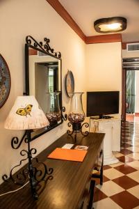 TV a/nebo společenská místnost v ubytování Casa del Balam Merida