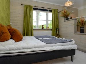 Katil atau katil-katil dalam bilik di Kolmårdsgården B&B