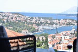a view of a city and a harbor from a balcony at Dubrovnik Icy Guest House in Dubrovnik