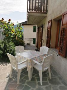 a table and chairs sitting on a patio at Appartamenti Fabila in Castello Tesino