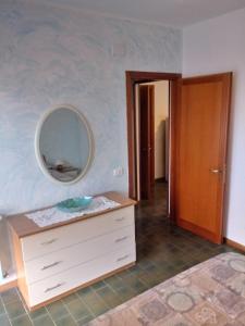 a bathroom with a sink and a mirror on the wall at Caletta Beach in Castiglioncello