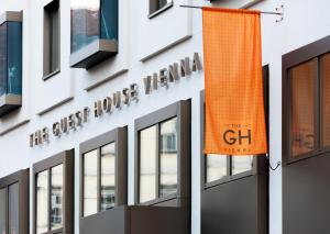 an orange flag on the side of a building at The Guesthouse Vienna in Vienna