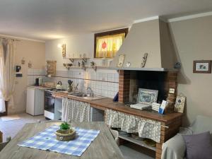 a kitchen with a sink and a counter top at Da Francesca in Palmadula