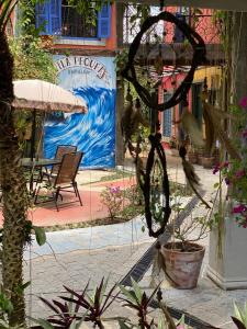 a bicycle is hanging in front of a patio at Vila Pequeá Ilhabela in Ilhabela