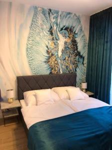 Ένα ή περισσότερα κρεβάτια σε δωμάτιο στο Apartament BŁĘKITNA LAGUNA