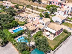 an aerial view of a house with a swimming pool at Vivere Apartment Barbati Beach in Barbati