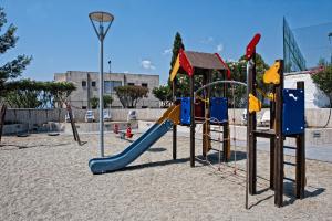 a playground with a slide at Hotel Villaggio Club Altalia Residence in Brancaleone Marina