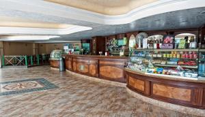 a bar in a hotel room with a counter at Hotel Villaggio Club Altalia Residence in Brancaleone Marina