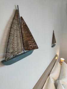 a shelf on the wall above a couch at Albergo La Pescatrice in Moniga