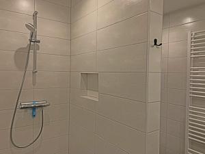 a bathroom with a shower with a glass door at Christinahoeve Oude Deel #4 in Boskoop +30 photos