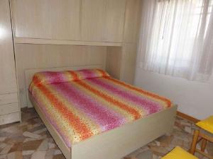 A bed or beds in a room at Apartments in Bibione 24609