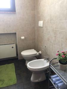 a bathroom with a toilet and a sink at Apartments in Sirmione/Gardasee 22559 in Sirmione
